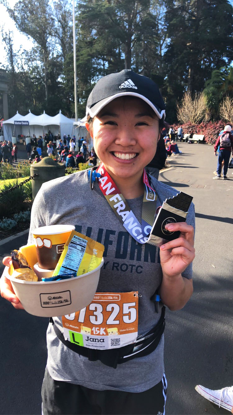 Jana Quan in running race holding medal