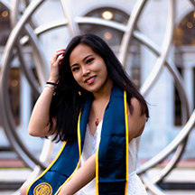 Sara Susanto in front of Hearst Mining Circle fountain